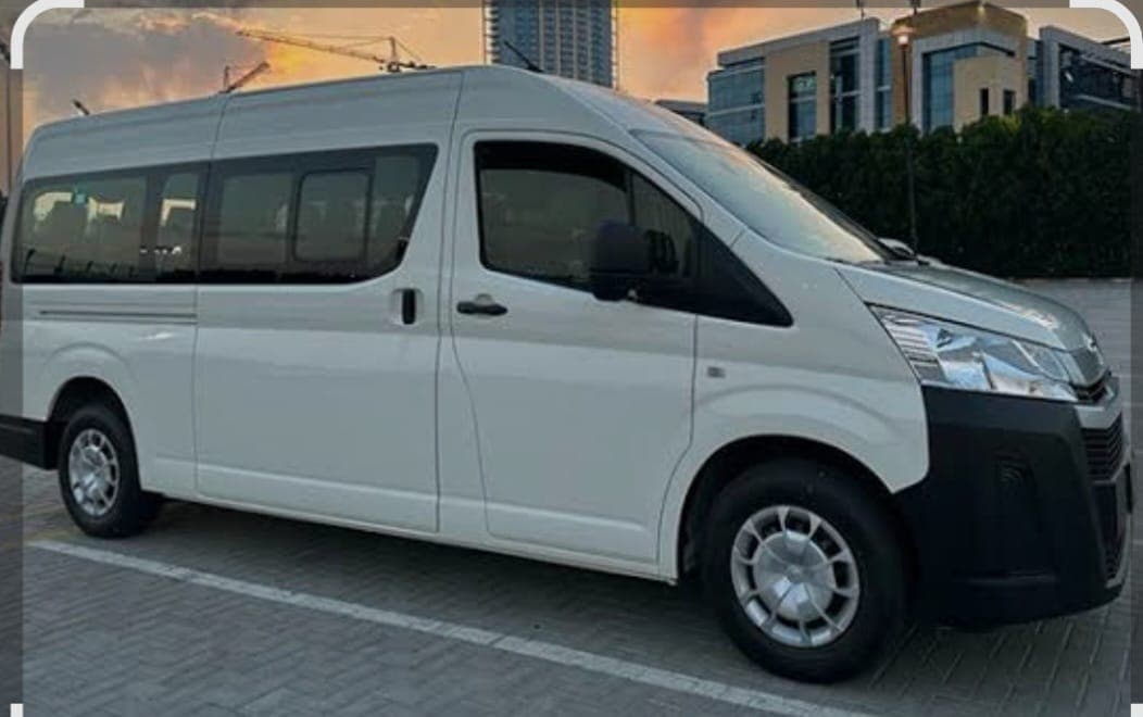 A high-roof passenger van from the Al Asr Al Jadeed Transport fleet, parked in Dubai